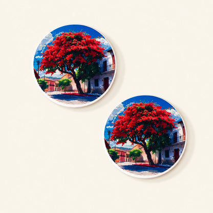 Diatom coaster featuring original artwork of blooming Gulmohar flowers.